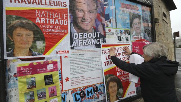 A French far-left Lutte Ouvriere (LO) party's member puts up posters of French presidential election candidate for LO party Nathalie Arthaud on February 5, 2017 in Chevilly-Larue, southern Paris - Sputnik International