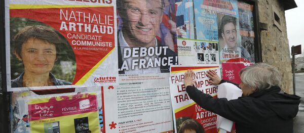 A French far-left Lutte Ouvriere (LO) party's member puts up posters of French presidential election candidate for LO party Nathalie Arthaud on February 5, 2017 in Chevilly-Larue, southern Paris A French far-left Lutte Ouvriere (LO) party's member puts up posters of French presidential election candidate for LO party Nathalie Arthaud on February 5, 2017 in Chevilly-Larue, southern Paris - Sputnik International