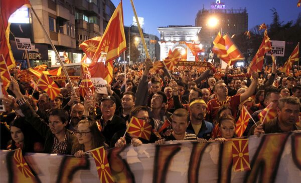 People protest in front of the Parliament building in Skopje, Macedonia, on Tuesday, March 21, 2017. Tens of thousands of demonstrators gathered in Macedonia's capital, Skopje, Tuesday to protest a visit by a European Union envoy who is trying to break the political deadlock that has left the country without a government for three months People protest in front of the Parliament building in Skopje, Macedonia, on Tuesday, March 21, 2017. Tens of thousands of demonstrators gathered in Macedonia's capital, Skopje, Tuesday to protest a visit by a European Union envoy who is trying to break the political deadlock that has left the country without a government for three months - Sputnik International