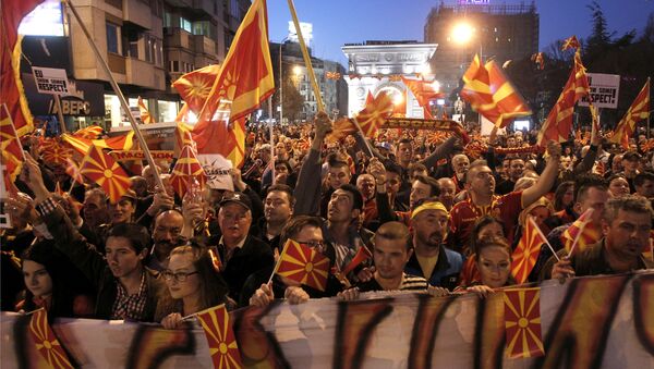 People protest in front of the Parliament building in Skopje, Macedonia, on Tuesday, March 21, 2017. Tens of thousands of demonstrators gathered in Macedonia's capital, Skopje, Tuesday to protest a visit by a European Union envoy who is trying to break the political deadlock that has left the country without a government for three months - Sputnik International