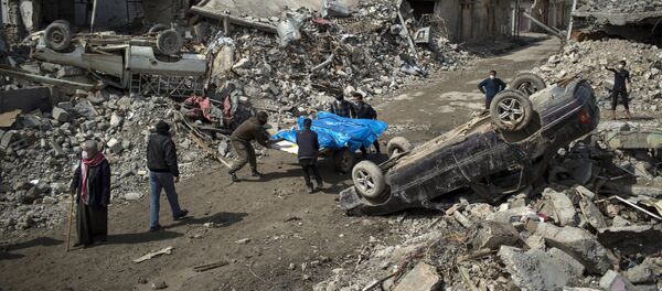Residents carry the body of several people killed during fights between Iraq security forces and Islamic State on the western side of Mosul, Iraq, Friday, March 24, 2017 Residents carry the body of several people killed during fights between Iraq security forces and Islamic State on the western side of Mosul, Iraq, Friday, March 24, 2017 - Sputnik International