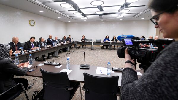 General view of the Syrian government delegation the start of a meeting between UN Special Envoy for Syria and Syria's government delegation during Syria peace talks in Geneva, Switzerland March 25, 2017 - Sputnik International