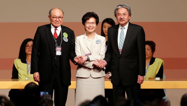 Candidates Woo Kwok-hing and John Tsang congratulate Carrie Lam (C) during the election for Hong Kong's next Chief Executive in Hong Kong, China March 26, 2017 - Sputnik International