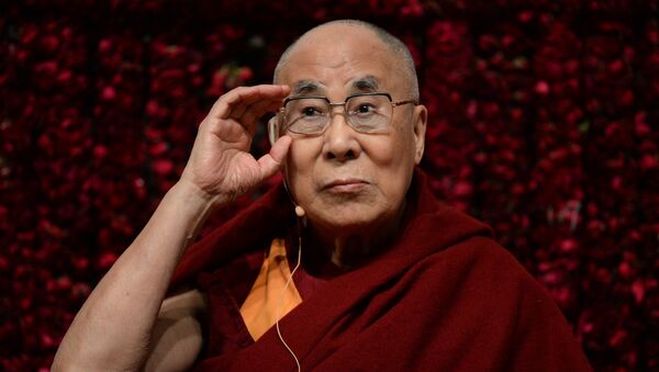 Tibetan spiritual leader, the Dalai Lama, gestures before delivering a public lecture on “Reviving Indian Wisdom in Contemporary India” at a function in New Delhi on February 5, 2017 - Sputnik International
