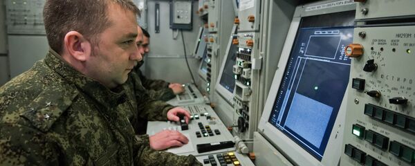 Officers of an air defense regiment of the Russian Armed Forces during a combat alert duty at the control board of an S-400 Triumf missile system in Crimea. Officers of an air defense regiment of the Russian Armed Forces during a combat alert duty at the control board of an S-400 Triumf missile system in Crimea. - Sputnik International