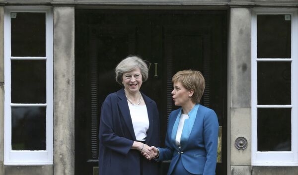 Scotland's First Minister Nicola Sturgeon greets Britain's new Prime Minister Theresa May as she arrives at Bute House in Edinburgh, July 15, 2016. - Sputnik International