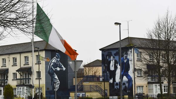 The Irish flag flies at half-mast after the death of Martin McGuinness, in the Bogside area of Londonderry, Northern Ireland, March 21, 2017. - Sputnik International