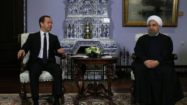 March 27, 2017. Russian Prime Minister Dmitry Medvedev meets with President of Iran Hassan Rouhani, right, on his official visit to Russia - Sputnik International