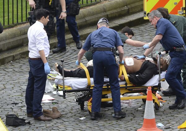 FILE- In this March 22, 2017 file photo, the attacker Khalid Masood is treated by emergency services outside the Houses of Parliament London. British Police named on Thursday March 23, 2017, Khalid Masood as The Houses of Parliament attacker FILE- In this March 22, 2017 file photo, the attacker Khalid Masood is treated by emergency services outside the Houses of Parliament London. British Police named on Thursday March 23, 2017, Khalid Masood as The Houses of Parliament attacker - Sputnik International
