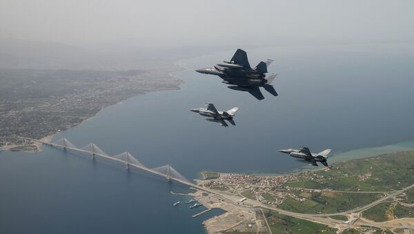 In this photo released by the Hellenic Air Force, two Greek F-16 fighter jets and a USAF F-15E Strike Eagles, based at Lakenheath airbase in England, fly past the 2,880-meter Rio-Antirrio Bridge in southern Greece, on Wednesday, April 13, 2016. The U.S. jets took part in Exercise Iniohos 2016, in southern Greece, together with military aircraft from Greece and Israel.  - Sputnik International