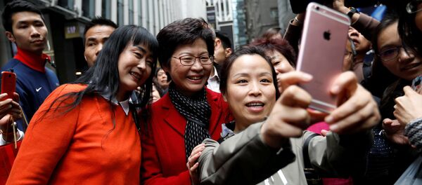 People take selfies with Carrie Lam, chief executive-elect, a day after she was elected in Hong Kong, China March 27, 2017 People take selfies with Carrie Lam, chief executive-elect, a day after she was elected in Hong Kong, China March 27, 2017 - Sputnik International