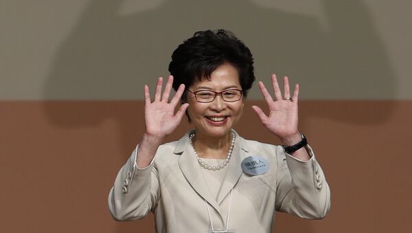 Former Hong Kong Chief Secretary Carrie Lam waves as she declares her victory in the chief executive election of Hong Kong in Hong Kong - Sputnik International