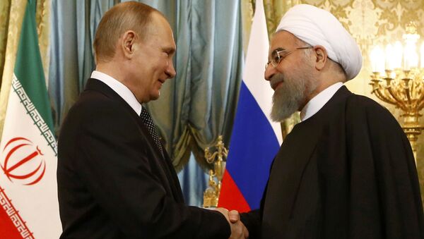 Russian President Vladimir Putin shakes hands with Iranian President Hassan Rouhani during their meeting at the Kremlin in Moscow, Russia March 28, 2017. - Sputnik International