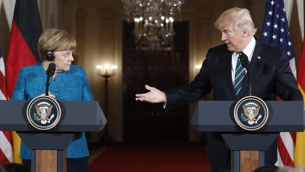 President Donald Trump and German Chancellor Angela Merkel participate in a joint news conference in the East Room of the White House in Washington - Sputnik International