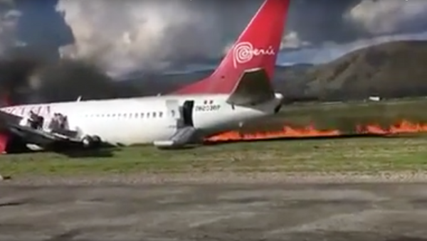 Peruvian Airlines reports all passengers aboard its jet that caught fire at Jauia airport are safe. - Sputnik International