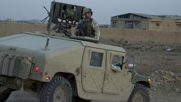US soldier sits on top of a Humvee - Sputnik International