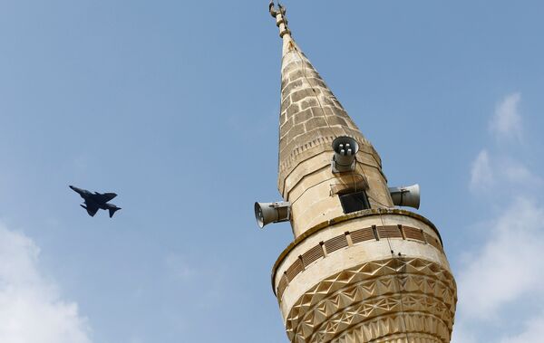 A Turkish Air Force F-4 fighter jet flies over a minaret after it took off from Incirlik air base in Adana, Turkey, August 12, 2015. A Turkish Air Force F-4 fighter jet flies over a minaret after it took off from Incirlik air base in Adana, Turkey, August 12, 2015. - Sputnik International