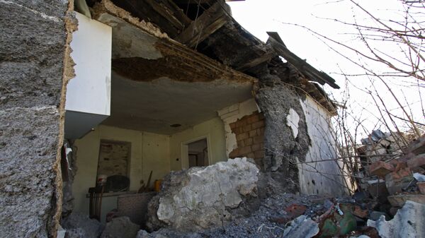 The house, damaged as a result of shelling, in the Kiev district of Donetsk - Sputnik International
