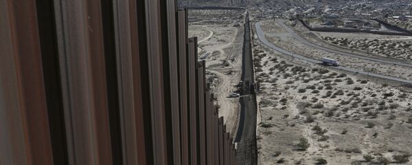 A truck drives near the Mexico-US border fence, on the Mexican side, separating the towns of Anapra, Mexico and Sunland Park, New Mexico A truck drives near the Mexico-US border fence, on the Mexican side, separating the towns of Anapra, Mexico and Sunland Park, New Mexico - Sputnik International