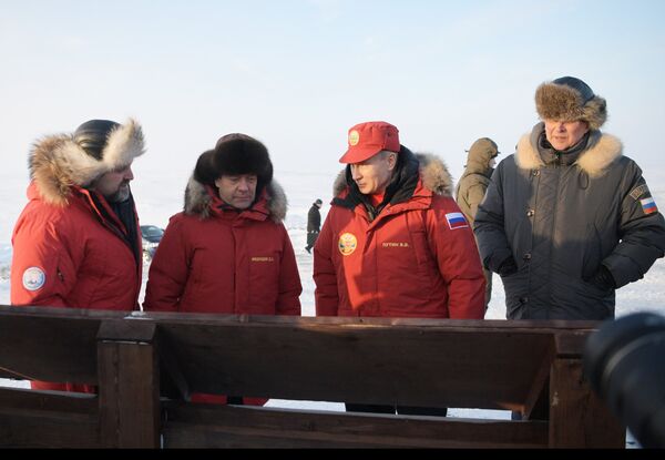 Russian President Vladimir Putin and Prime Minister Dmitry Medvedev at Franz Josef Land archipelago's Alexandra Land. Natural Resources and Environment Minister Sergei Donskoi, left - Sputnik International