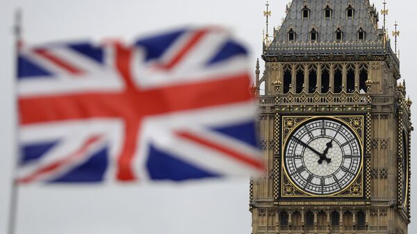 British Union flag waves in front of the Elizabeth Tower at Houses of Parliament containing the bell know as Big Ben in central London - Sputnik International