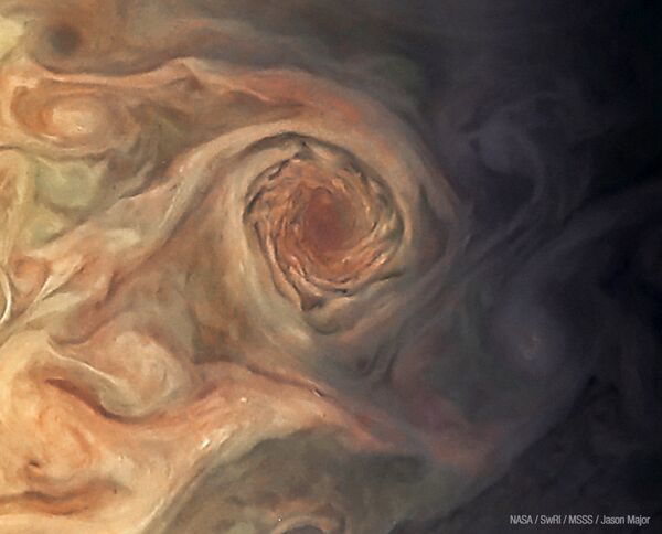 This Juno photo of Jupiter isn't the Red Spot, but rather the white pearl storms on Jupiter, just southwest of the White Oval. - Sputnik International