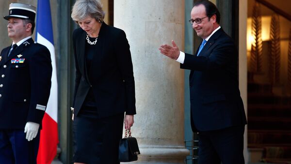 France's President Francois Hollande gestures as Britain's Prime Minister Theresa May leaves the Elysee Palace, in Paris, Thursday, July 21, 2016. - Sputnik International