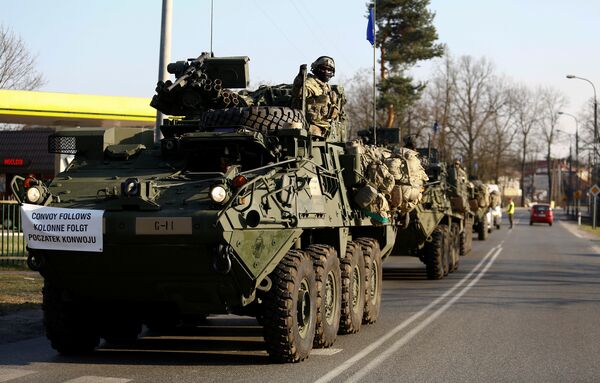 A convoy of U.S. troops, a part of NATO's reinforcement of its eastern flank, who are on their way from Germany to Orzysz in northeast Poland, drive through Sulejowek towards a military base in Wesola, near Warsaw, Poland, March 28, 2017 A convoy of U.S. troops, a part of NATO's reinforcement of its eastern flank, who are on their way from Germany to Orzysz in northeast Poland, drive through Sulejowek towards a military base in Wesola, near Warsaw, Poland, March 28, 2017 - Sputnik International