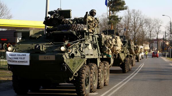 A convoy of US troops, a part of NATO's reinforcement of its eastern flank, who are on their way from Germany to Orzysz in northeast Poland, drive through Sulejowek towards a military base in Wesola, near Warsaw, Poland, March 28, 2017 - Sputnik International