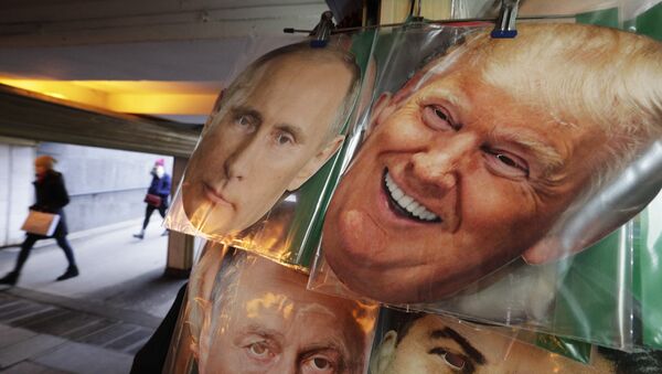 In this Monday, Feb. 20, 2017 photo face masks depicting Russian President Vladimir Putin and US President Donald Trump hang on sale at a souvenir street shop in St.Petersburg, Russia - Sputnik International
