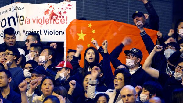 Members of the Chinese community shout slogans during a protest at Place de la Bastille in Paris, France, March 30, 2017 - Sputnik International
