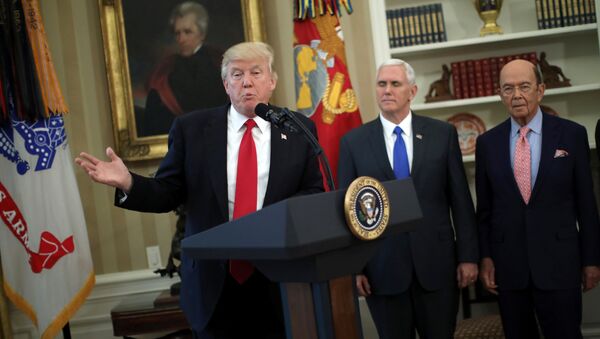 U.S. President Donald Trump speaks during a signing ceremony of executive orders on trade, accompanied by Vice President Mike Pence (C) and U.S. Commerce Secretary Wilbur Ross (R) at the Oval Office of the White House in Washington, U.S., March 31, 2017 - Sputnik International