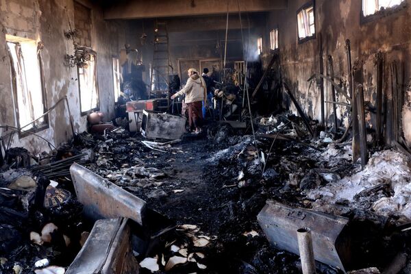 A man examines the damage at the National Museum in the war-torn city of Taiz, Yemen A man examines the damage at the National Museum in the war-torn city of Taiz, Yemen - Sputnik International