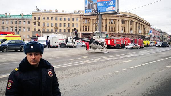 Emergency vehicles and a helicopter are seen at the entrance to Technological Institute metro station in Saint Petersburg on April 3, 2017 - Sputnik International
