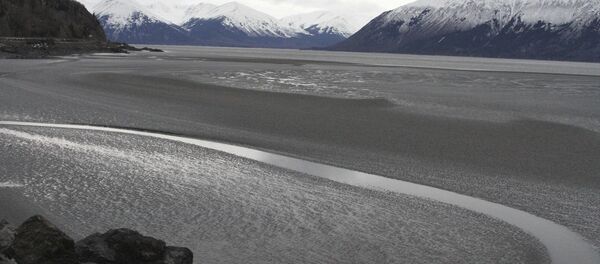 A ribbon of water cuts through the mud flats of Cook Inlet, just off the shore of Anchorage, Alaska. Natural gas is bubbling up from an underwater pipeline in Alaska's Cook Inlet. A ribbon of water cuts through the mud flats of Cook Inlet, just off the shore of Anchorage, Alaska. Natural gas is bubbling up from an underwater pipeline in Alaska's Cook Inlet. - Sputnik International