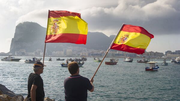 Spanish fishermen wave Spanish flags during a protest in the bay of Algeciras on August 18, 2013. A Spanish protest fleet of 38 fishing boats sailed towards Gibraltar today to demand the British outpost remove 70 concrete blocks it has dropped in their fishing grounds. - Sputnik International