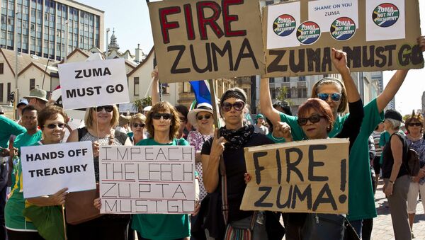 Protestors hold up placards reading 'Fire Zuma' during a demonstration of supporters of the Save South Africa (SaveSA) campaign, civil society organisations and political parties demanding South African President Jacob Zuma to resign on April 4, 2017 in Port Elizabeth, South Africa - Sputnik International