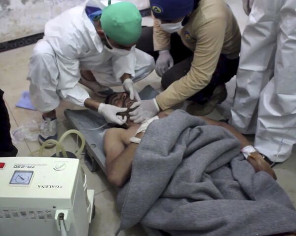 A victim of a suspected chemical attack as he receives treatment at a makeshift hospital, in the town of Khan Sheikhoun, northern Idlib province, Syria. File photo A victim of a suspected chemical attack as he receives treatment at a makeshift hospital, in the town of Khan Sheikhoun, northern Idlib province, Syria. File photo - Sputnik International