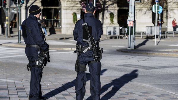 Armed police officers at the Gustaf Adolfs square in central Stockholm, Sweden on 21 November 2015. - Sputnik International