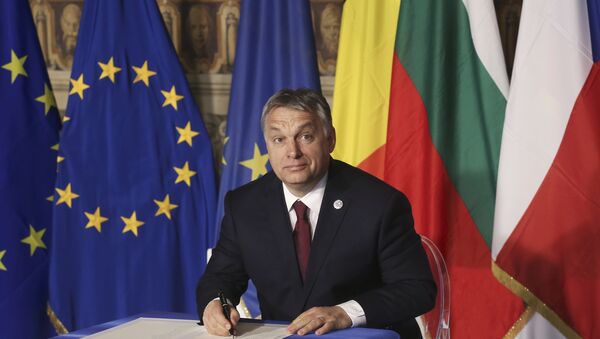 Hungary's Prime Minister Viktor Orban signs a document during the EU leaders meeting on the 60th anniversary of the Treaty of Rome, in Rome, Italy March 25, 2017. - Sputnik International