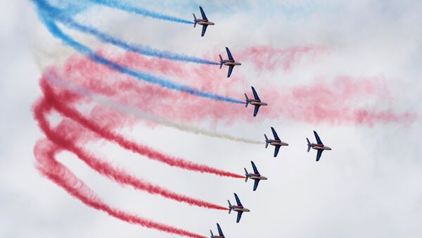 Alphajet aircrafts from the French elite acrobatic flying team Patrouille de France (PAF) release smoke in the colors of the French flag at the International Paris Airshow at Le Bourget. (File) - Sputnik International