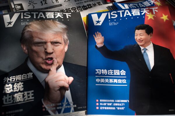 Magazines featuring front pages of US President Donald Trump (L) and China's President Xi Jinping (R) are displayed at a news stand in Beijing - Sputnik International