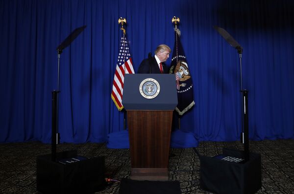 President Donald Trump walks from the podium after speaking at Mar-a-Lago in Palm Beach, Fla., Thursday, April 6, 2017, after the U.S. fired a barrage of cruise missiles into Syria Thursday night in retaliation for this week's gruesome chemical weapons attack against civilians. President Donald Trump walks from the podium after speaking at Mar-a-Lago in Palm Beach, Fla., Thursday, April 6, 2017, after the U.S. fired a barrage of cruise missiles into Syria Thursday night in retaliation for this week's gruesome chemical weapons attack against civilians. - Sputnik International