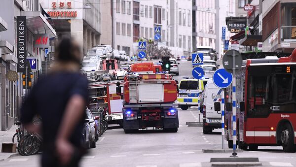 Emergency servies work at the scene where a truck crashed into the Ahlens department store at Drottninggatan in central Stockholm - Sputnik International