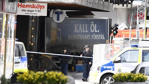 Police cordon off the truck which crashed into the Ahlens department store at Drottninggatan in central Stockholm - Sputnik International