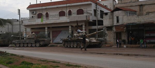 Armored vehicles in a village in the north of Hama, Syria - Sputnik International