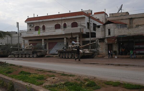 Armored vehicles in a village in the north of Hama, Syria - Sputnik International
