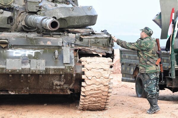 Syrian army troops during an assault on the city of Halfaya in the north of the Hama Governorate Syrian army troops during an assault on the city of Halfaya in the north of the Hama Governorate - Sputnik International