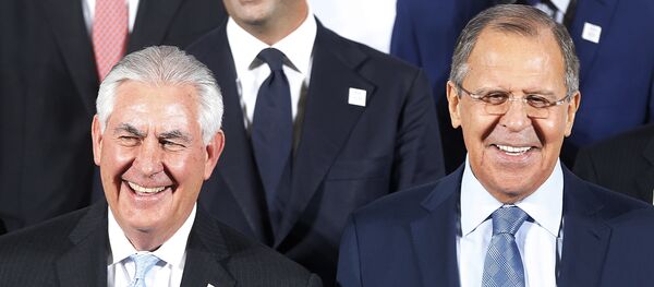 The Russian foreign minister Sergey Lavrov, right, and US Secretary of State Rex Tillerson stand together during the G-20 Foreign Ministers meeting in Bonn, Germany - Sputnik International