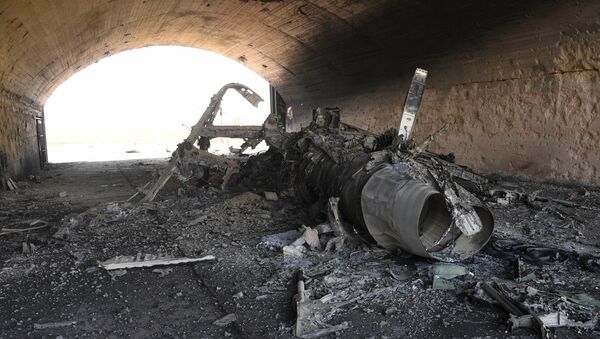 The body of a plane burned as a result of the US missile attack on an air base in Syria. File photo - Sputnik International